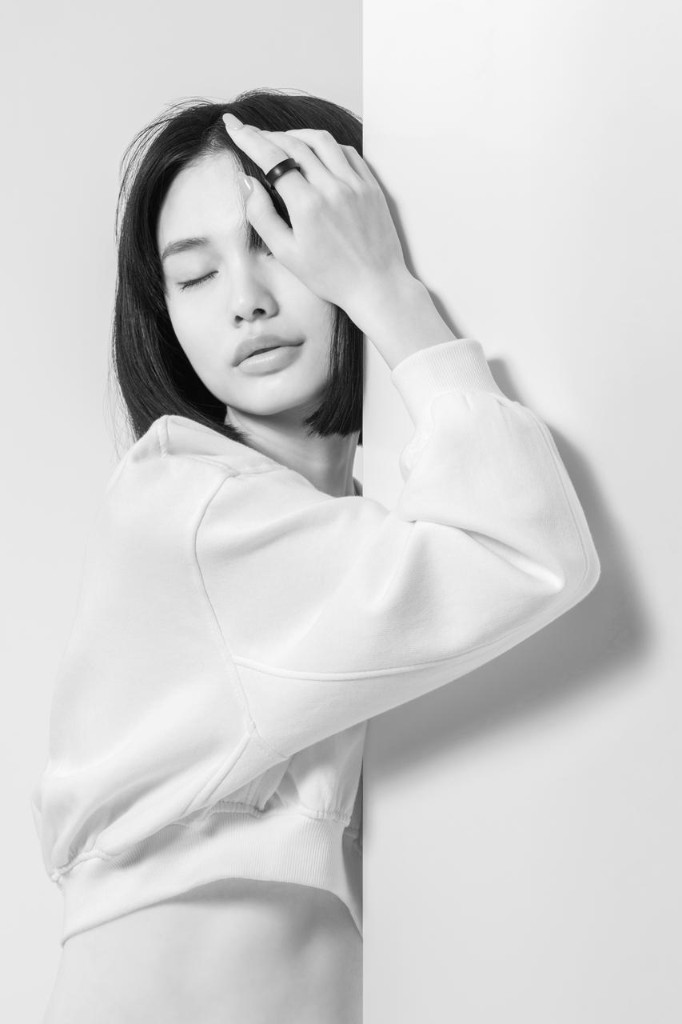 DR H editorial portrait — quiet gesture against a white edge