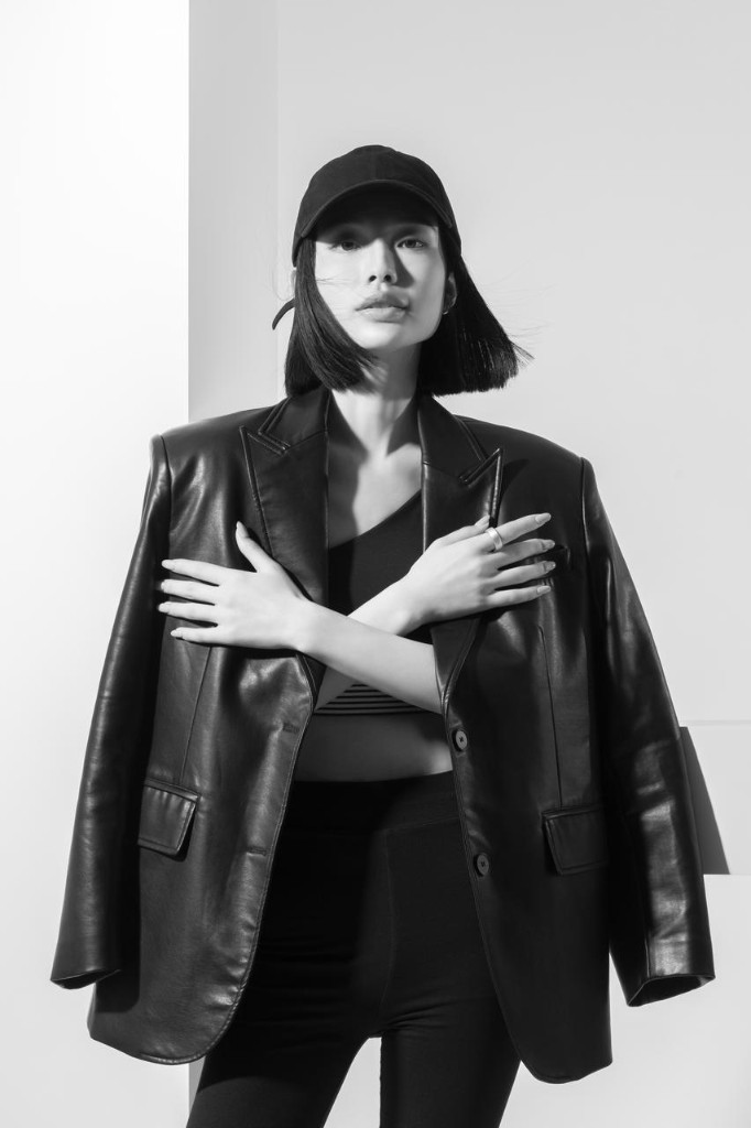 DR H editorial portrait — leather blazer and ring detail
